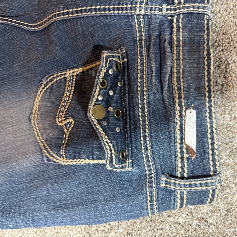 Almost Famous Blue Jeans with Decorative Stitching and Metal Embellishments